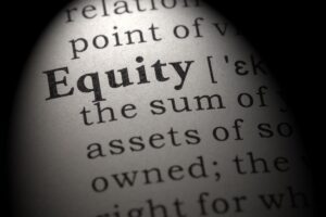 an image showing page with text on it, with focus on equity word which is bold as compared to other words, this image represents how to spot equity release companies to avoid