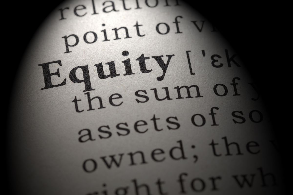 an image showing page with text on it, with focus on equity word which is bold as compared to other words, this image represents how to spot equity release companies to avoid