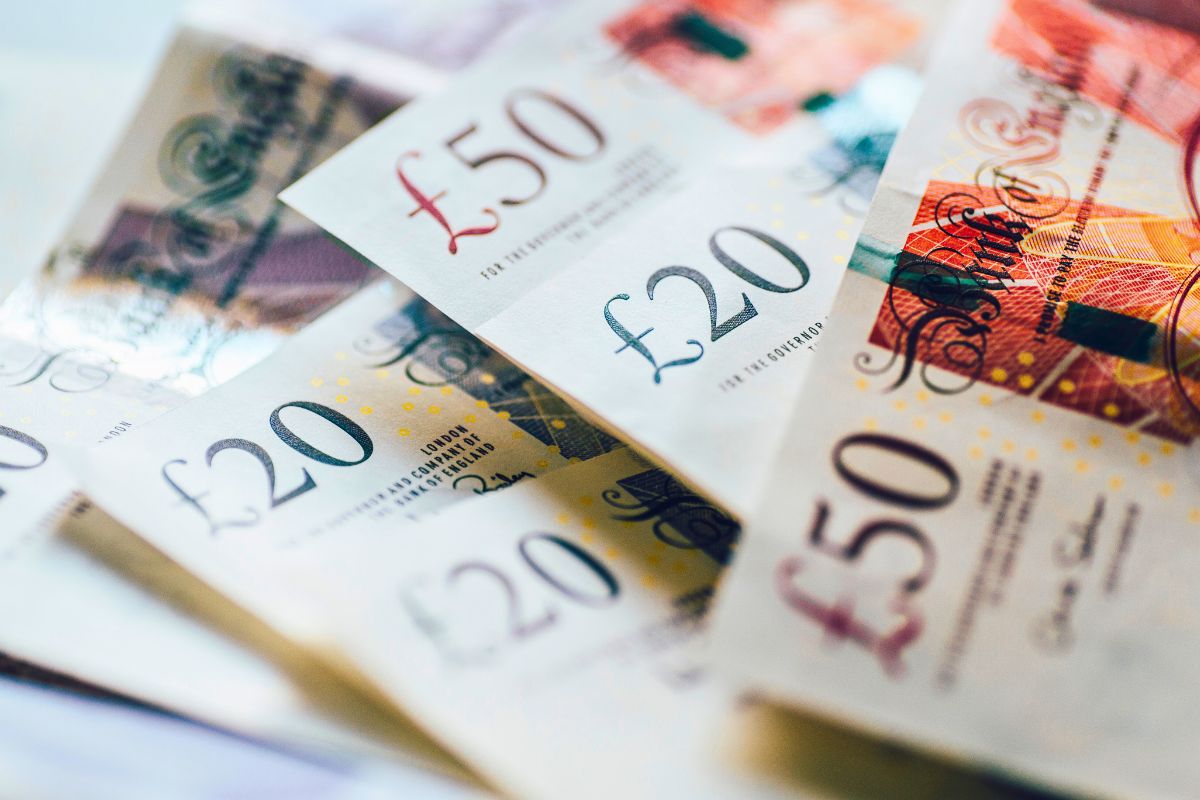 British pounds stacked over each other representing when is the next cost of living payment